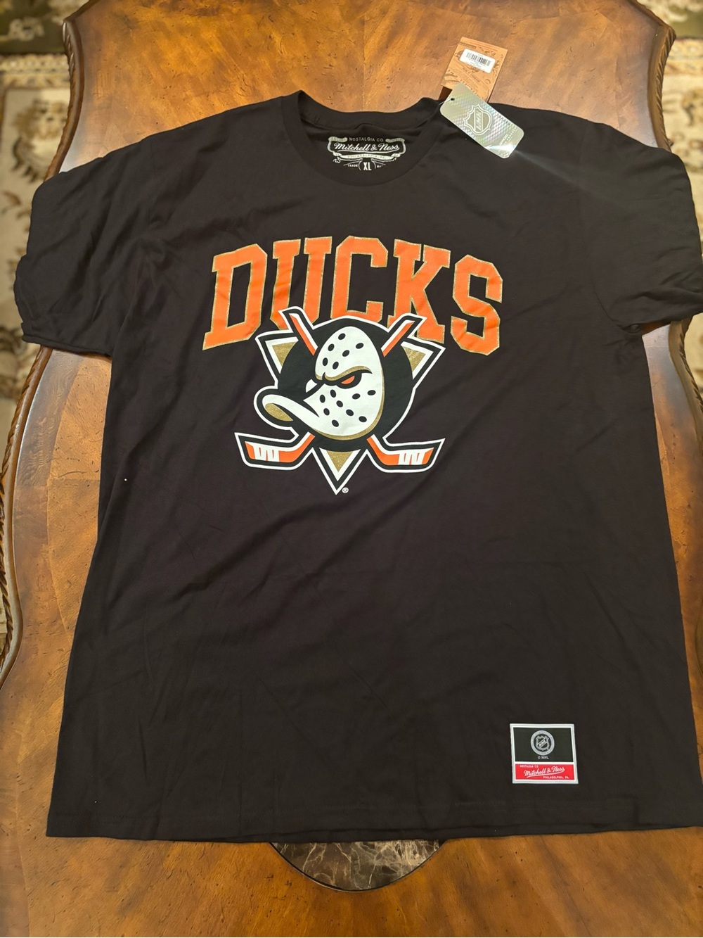 Mitchell & Ness Anaheim Mighty Ducks Black Tee with Orange & Gold Print